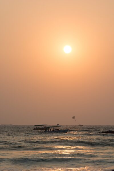 Baga beach sunset with boats in foreground